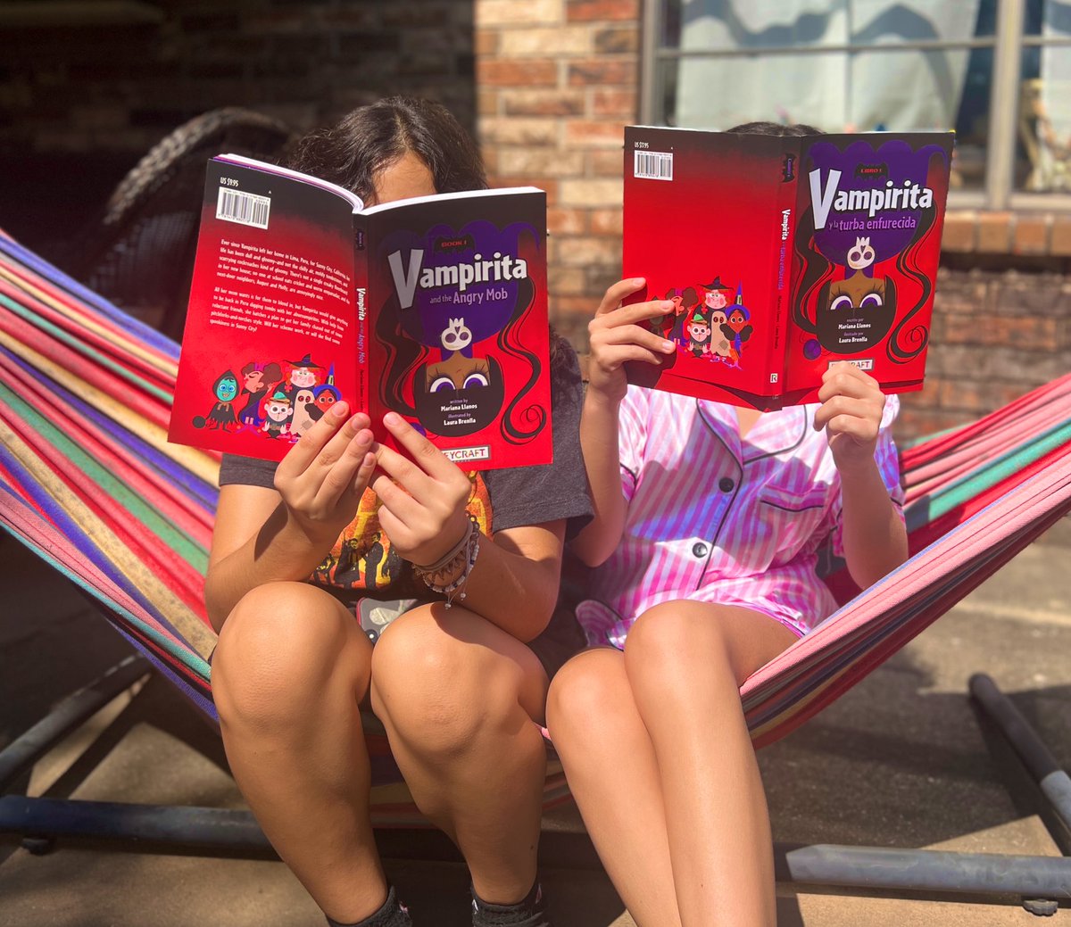 marianallanos's tweet photo. One cousin is reading it in English, the other one in Spanish. Then, they’ll swap! The joys of reading in two languages! #bilingual #Vampirita https://t.co/Fo4sdJe7XL
