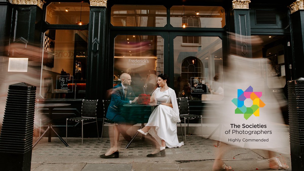 So chuffed to be awarded a highly commended for this Wedding photo this month.
Thank you <a href="/TheSocieties/">The Society of Photographers 📷</a> 
Taken outside Frederick’s in Camden Passage, Islington. 
I had the idea and tried not to nag my couple too much to do it! 
#photographyaward #londonwedding #weddingphotographer