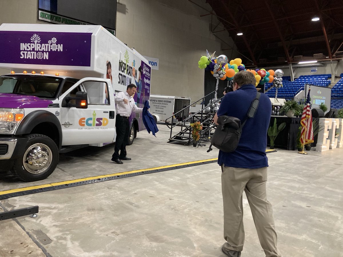 Ecisd superintendent Scott Muri drives the Inspiration Station into the coliseum at convocation Tuesday.