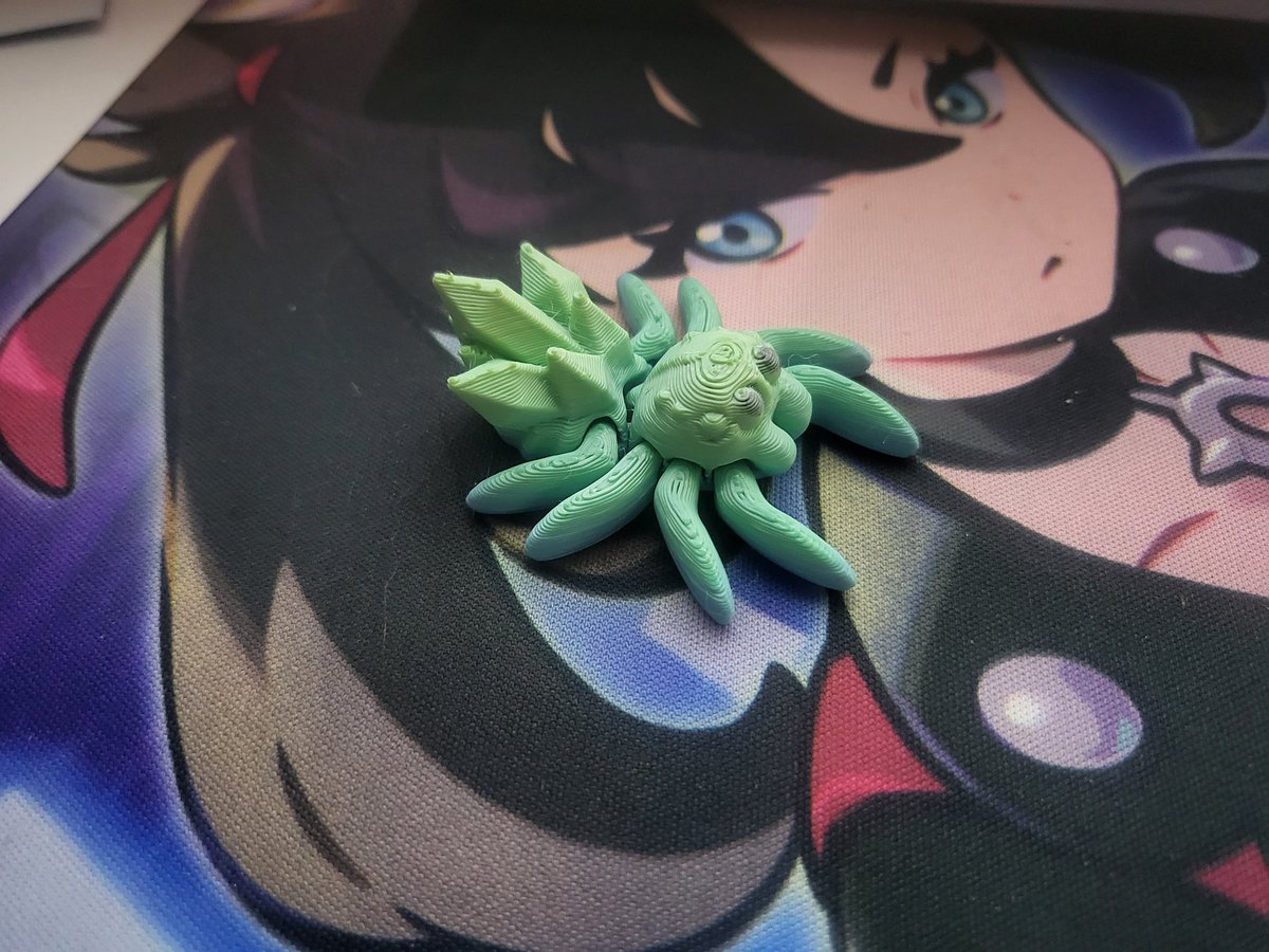 My mom came out to visit this last weekend and hid a bunch of 3D printed spiders around the house before she left, this little guy is my fav lol help me pick a name for my new desk buddy!