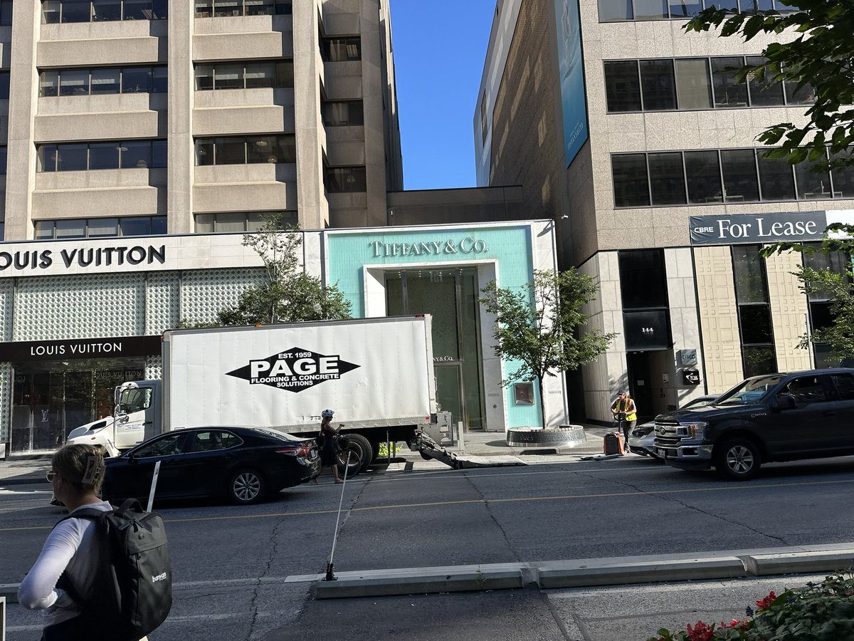 ChrisSnoyer's tweet photo. A truck is parked PRECISELY where the dumpster was left the other day (in the bike lane) where a cyclist died at Bloor and avenue.. https://t.co/iRbEVae513