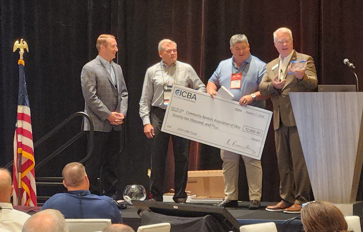 DoddFrankUpdate's tweet photo. Live coverage from the 50th Annual @CBAO1974 Convention in Columbus. Here, @ICBA Immediate Past Chairman Derek Williams accepts a check for $72k on behalf of Ohio community bankers. #ConferenceCoverage https://t.co/k4b0XZ8MAU