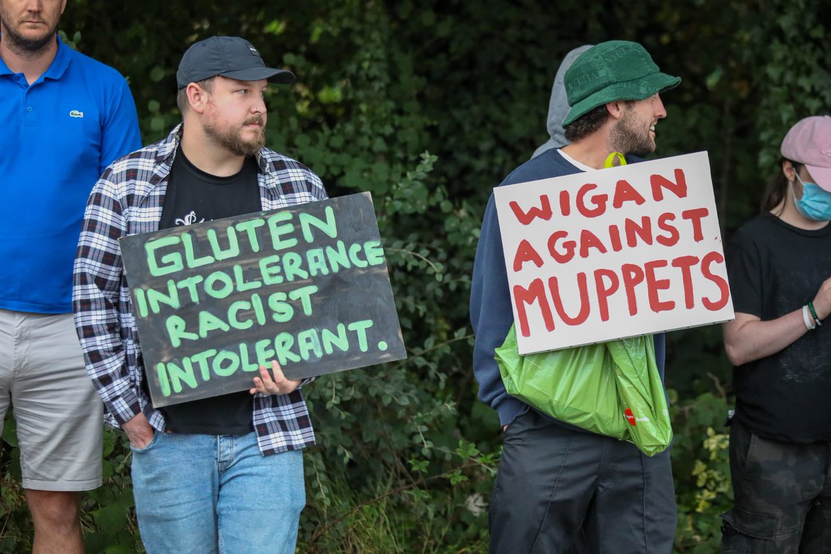 There’s also a group of about ten counter-protesters here. One of them is holding a sign that reads ‘Wigan Against Muppets’ <a href="/MENnewsdesk/">Manchester News MEN</a>