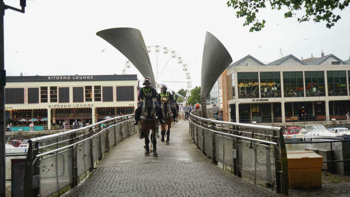 📷 Mounted officers cross Pero's Bridge. 

The police presence in and around West Street in Old Market is growing, but otherwise the streets remain quiet, with the majority of shop fronts closed or boarded up.

Follow our live report: bit.ly/4dAkW9U