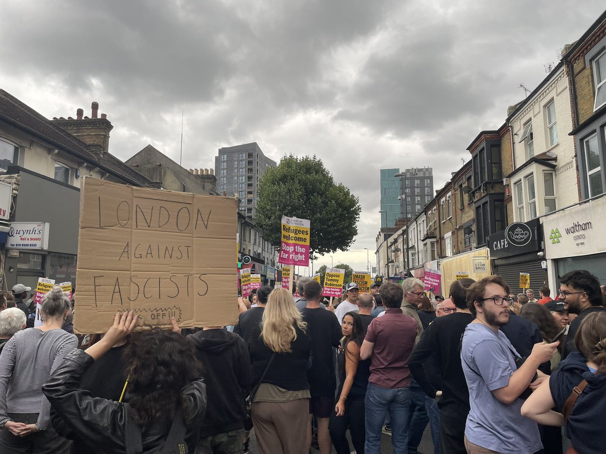 Hundreds of antifascist protesters have gathered in Hoe Street in Walthamstow ahead of a planned march. Massive police presence - several riot fans and dozens of officers.