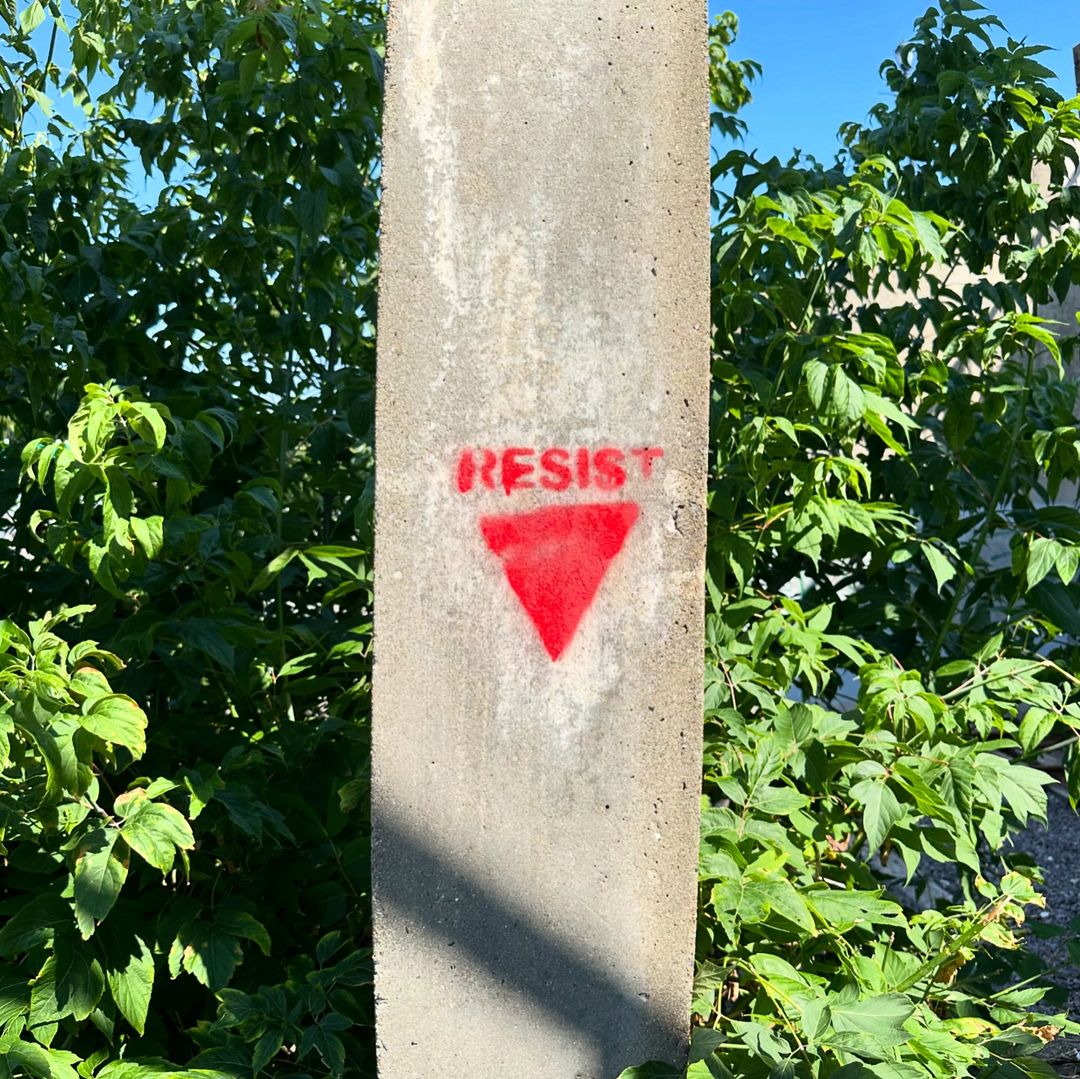 OnlinePalEng's tweet photo. "RESIST" along with the red triangle has been painted on the walls in Salem, Massachusetts.🔻🇵🇸 https://t.co/pFLvpjAWMh