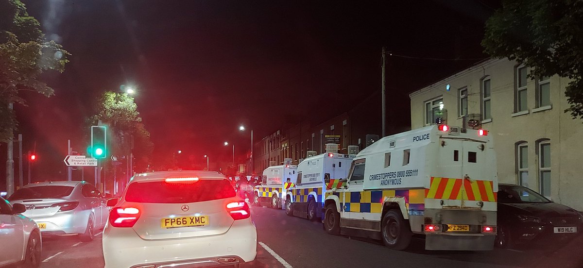 Trouble on Bloomfield Avenue at intersection with Newtownards Road in east Belfast. Riot police now blocking road as drivers doing U turns. Missiles being thrown towards police lines