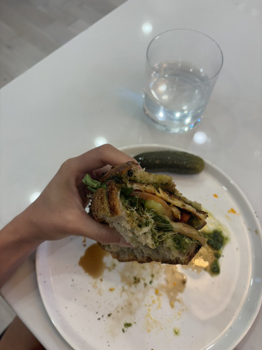 Chili crisp honey, grilled halloumi, pesto, heirloom green tomato, sprouts, balsamic vinegar, Palestinian olive oil