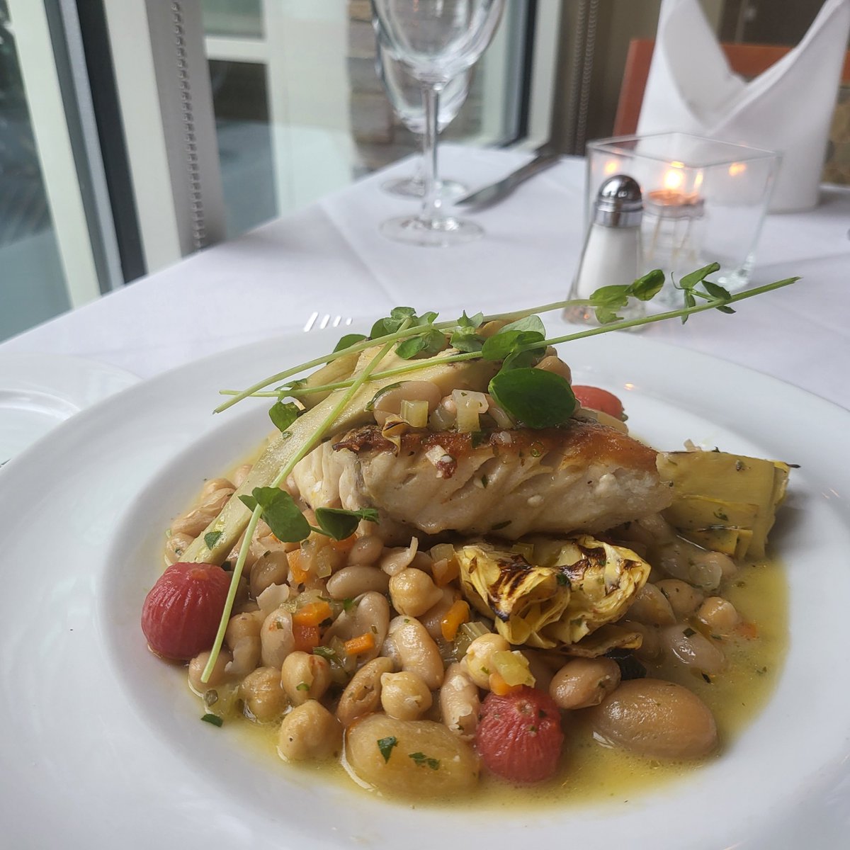 Pan seared red Snapper, braised white &amp; garbanzo beans, heirloom tomato confit, grilled artichokes, fresh herbs, extra virgin olive oil feature by Executive Sous Chef Walter Balkiewicz