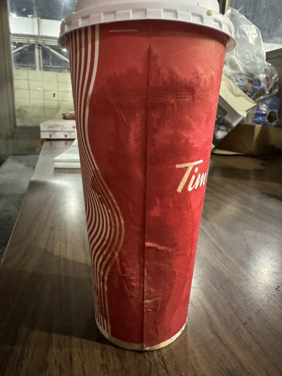LenSceneAMovie's tweet photo. Haven’t had a coffee all week, got one at 5am on my way to work.  By the time I changed and went for my first sip, the coffee was all over the lunchroom table.  Thanks for nothing @timhortons_hq https://t.co/9i6PAlaHVq
