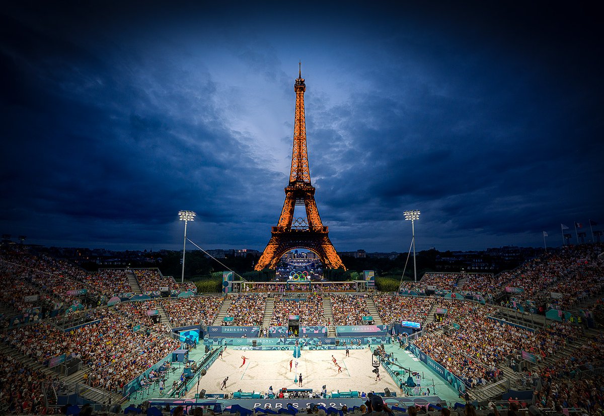 nickdidlick's tweet photo. Beach Volleyball under the Effiel Tour and dark clouds as competition continues at the Paris 2024 Summer Olympic Games. #paris2024 #beachvolleyball #summerolympic #olympicgames #bestsummer #landmark #cloudy #niceatmosphere #shutterbugs #bluestagram https://t.co/mzf7Bquf5g
