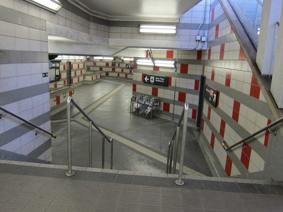 stationfixation's tweet photo. Ouch! The dizzying tile scheme beneath the Walmer Road entrance of Spadina station. What was going through the designer's mind? I always feel like I'm entering some kind of low-res FPS video game. https://t.co/bi6u6GO5ii