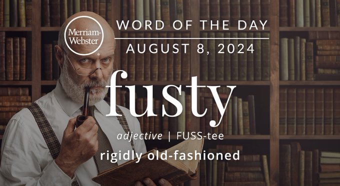 Merriam-Webster Word of the Day August 8, 2024 'fusty' adjective | FUSS-tee "rigidly old-fashioned" Background Image: An older gentleman in a library smoking a pipe