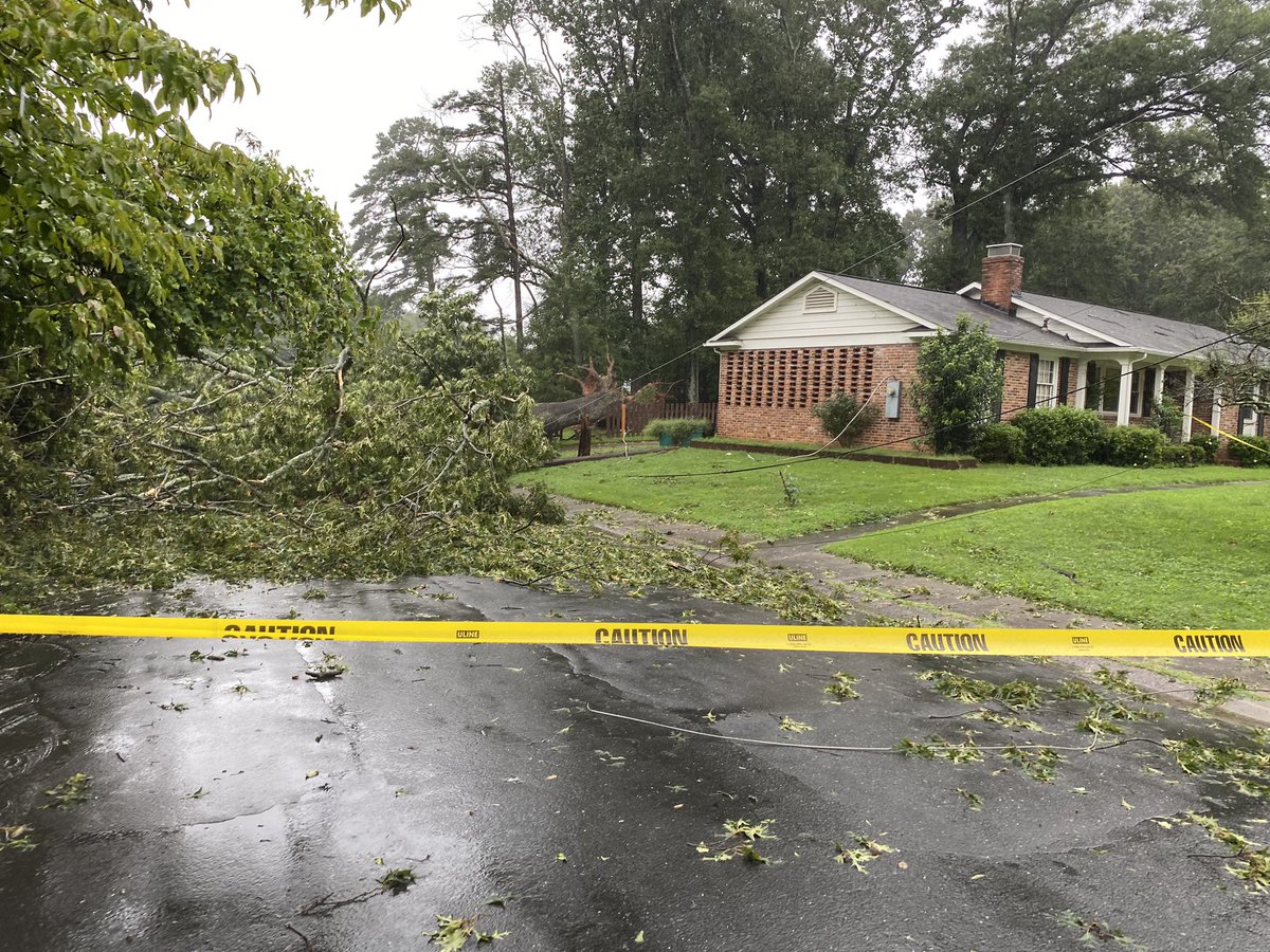 Downed tree from this morning just misses this south Charlotte home. It did clip power lines on its way down. #cltwx