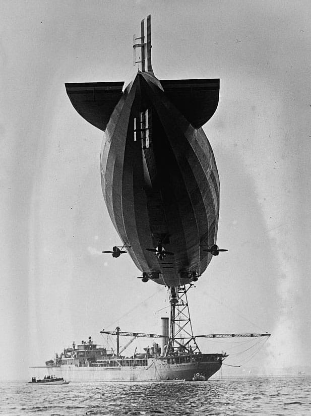 US Navy dirigible USS Shenandoah docks with airship tender USS Patoka off the coast of Newport, Rhode Island, proving that airships can operate from support ships far out at sea.