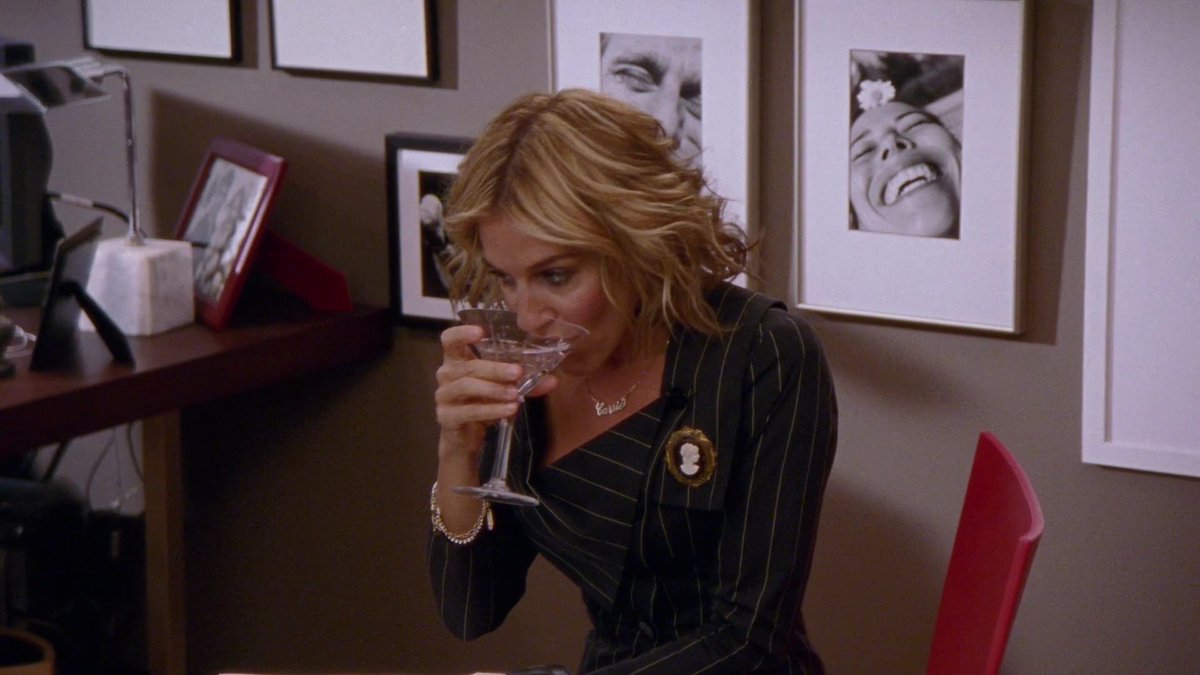 dumbandfunn's tweet image. Carrie Bradshaw getting drunk in the Vogue office while wearing a Vivienne Westwood pinstripe suit set