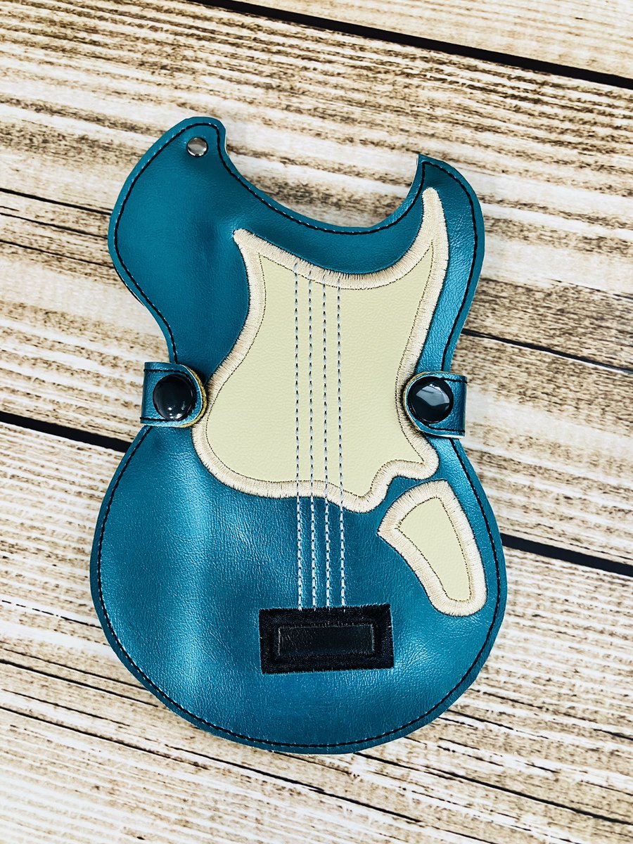 Qualitycuddles's tweet photo. I made a guitar pick holder for one of mg customers while embroidering their band jackets 🎸 #band #guitar https://t.co/yjcS5xvWK4