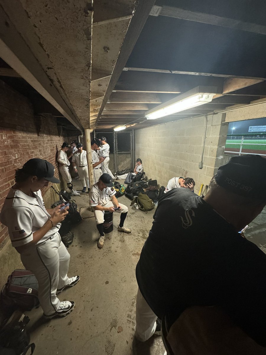 We are in a rain delay here in the top of the 4th with the game tied at 2-2 and Cumberland hitting with one out and a runner on 1st base. 

Here are Shrewsbury Post 397 getting cover and checking on the Patriots game.