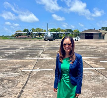 Ambassador Chung standing in front of one of the C-130s that flew to Sri Lanka for Atlas Angel 2024