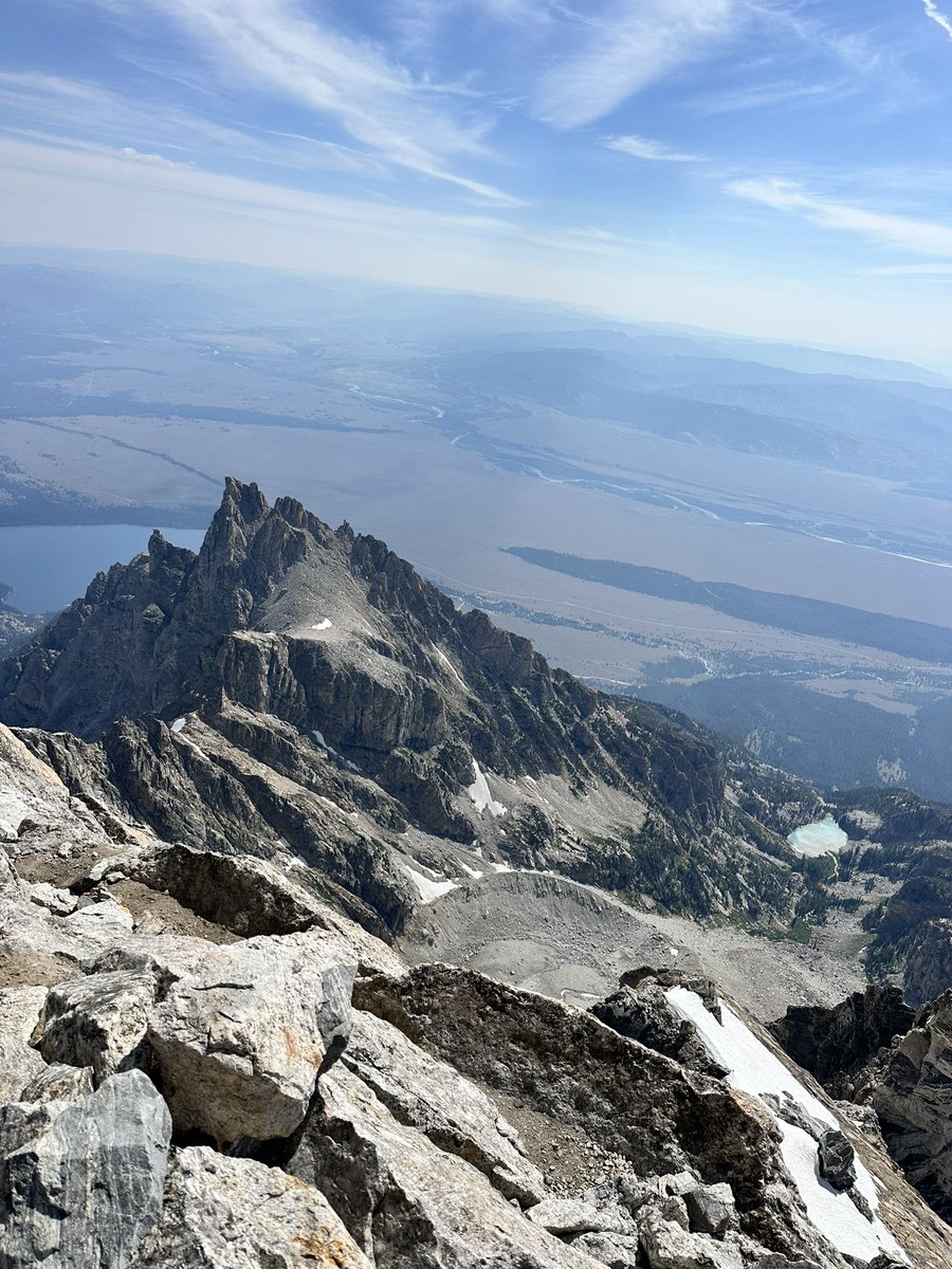 jrdbrt's tweet photo. I have a fear of heights. 

It started when I fell off the glacial northeast face of Table Mountain (elevation 11,111 ft) in the Grand Teton Mountain range at age 18. This past weekend, I took this picture of that glacier on Table Mountain from Lower Saddle of the Tetons.

Several months ago, I hired a virtual nutrition and fitness coach, Cecily Stoddard. It was an affordable option that gave me tremendous flexibility to work around my crazy schedule. I've never met her in person, but she designed nutrition and fitness plans and pushed them to a fitness app to follow. For the first time since high school, I've been doing deadlifts and reverse lunges in my workout routine. I'm in the best shape I've been in since high school.

My supportive wife and best freind, Nicole, went on walks with me constantly. I hiked on trails almost every day averaging about 16,000 steps a day for several weeks. On my hikes in mountains in Idaho and Colorado, I would stand next to cliffs and meditate until I could keep my balance and focus without freaking out. I practiced bouldering. I took a lead climbing course at the local climbing gym.

I talked with experienced climbers that summited the Grand, like Gary Cooper. Gary has summited the Grand over 50 times. He told me there wasn't anything I couldn't do on that climb and I started to believe him. He told me how. One thing he said was to make sure I lather up my parts with Vaseline and leave my fly open for venting. I didn't do that, but I did everything else he told me to do.

Gary said if I could climb the football stadium stairs 20 times in 30 minutes with pack on, I could climb the Grand in 14 hours. I finally made the 30 minute time a week before.

I was the weakest in our group. Two 25-yr old high school friends and hard-core mountaineers, Van Stott Silver and Kesler Hortin. (I'm confident they saved my life about 10 times on that mountain) Then, me and my high school friend Chris Waddell, both from the 1900's. We visited the art gallery in Jackson Hole before we hit the trail and Chris gave me a lesson in the arts. I was inspired for the trek. He's a brilliant artist and sculptor, one of the most talented and kind people I know.

Somehow we made it. It took a humbling 22 hours. There were many moments I felt like we were in big trouble. Like when I had to stretch around a boulder, gripping with my fingers and toes as I scooted around the Belly Roll hanging out over a 2,000 ft vertical cliff. (see photo) We prayed focused and fought through the challenges one at a time. I knew my family was praying for me. I had studied hours of videos and read books about the climb and still with all the preparation, I had to experience it all to know it.

@jimkchin was on the summit with his daughter and Jimmy smiled at me while I was stepping up. As if I made it to heaven and God was smiling at me to say, "See, I told you it would be worth it." It was surreal at the summit. I wept for 10 minutes as I looked down at Teewinot Mountain (elev 12,330 ft). The Grand Teton ascends to 13,775 ft).

I'm not scared of heights anymore.