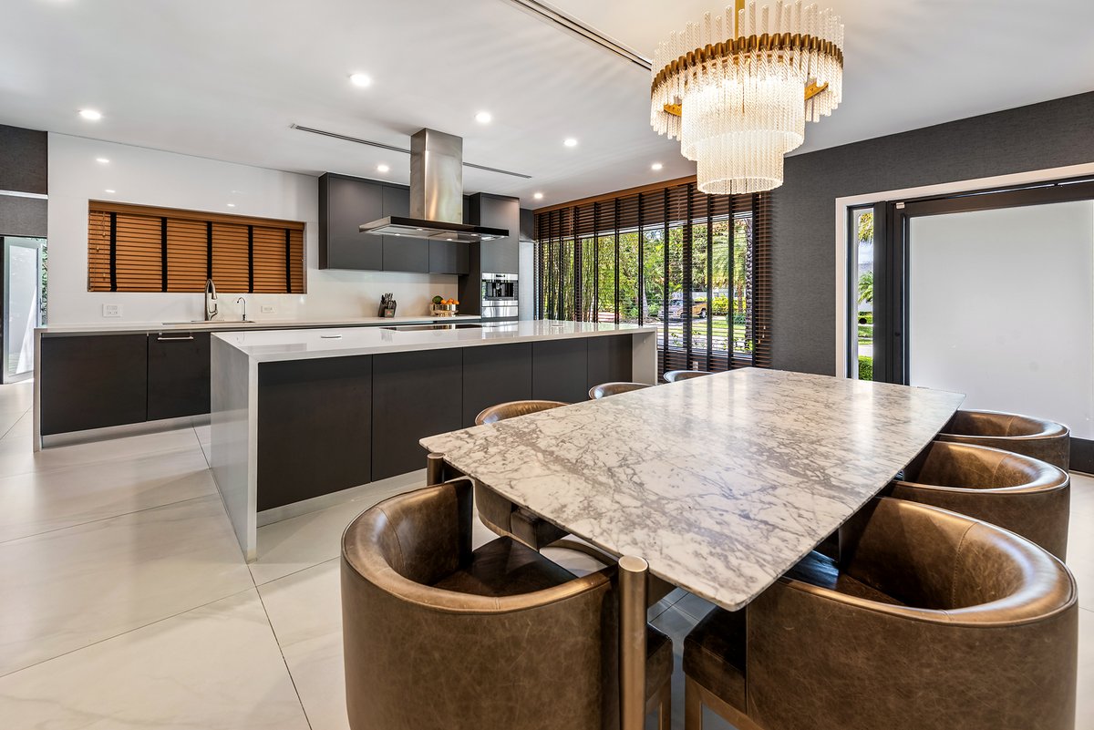 Experience luxury living in Sky Lake! 🌴 Fully renovated home on a corner lot, featuring a tropical oasis with a pool, jacuzzi, and summer kitchen. Inside: Italkraft kitchen, Miele &amp; Sub-Zero appliances, motorized blinds, and porcelain floors. Close to top schools &amp; shopping.