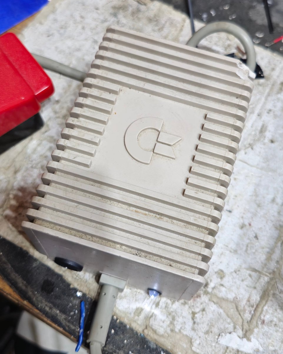 CommodoreLad's tweet image. Shameless advertising coming up. I had some busted 64 psus which I get innards out of. I then fit brand spanky new innards to make them back into 64 psus again. They come with a &quot;No Nuke&quot; guarantee. (ish). External replaceable fuse and a little &quot;I&apos;m on&quot; LED. DM me if…
