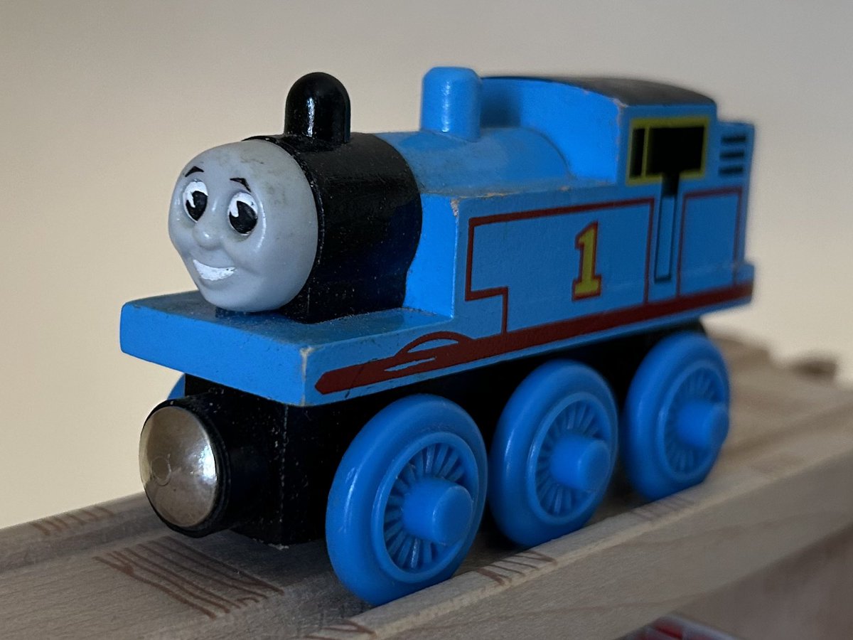 Tangent_Thomas's tweet image. Proof of concept prototype Thomas engine for the Wooden Railway 10 Years in America pack. 

This Thomas is identical to a normal 1999 release with mouth and eye details painted on, similar to the one used for the product photos. The final release also had a plastic smokebox.