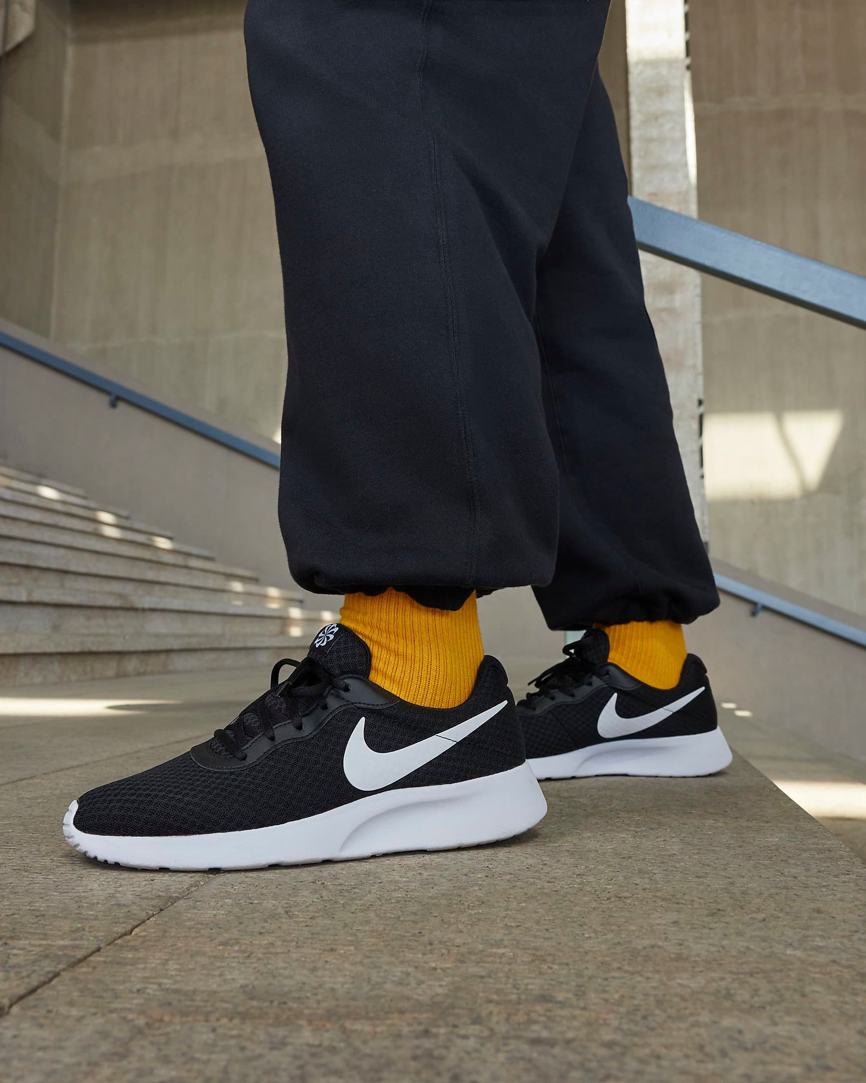 Nike tanjun white on feet hot sale