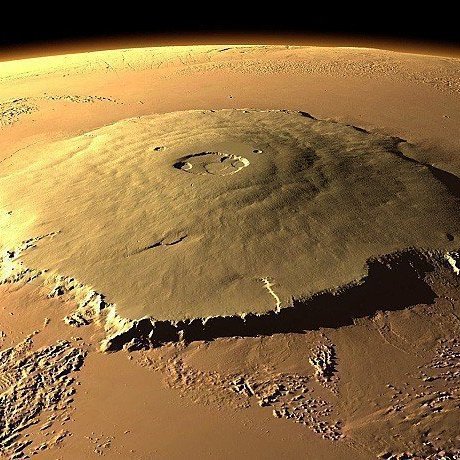 The tallest mountain in the solar system, Olympus Mons on Mars. It has a height of 25 km, Mount Everest is 'only' 8.8 km tall.