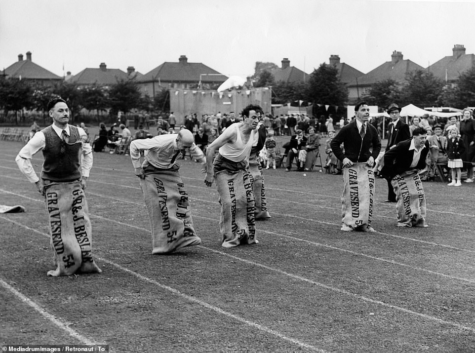 YesterdaysBrit1's tweet photo. The 1950s, and these fellas are going for gold 🥇in the sack race.

No doubt they would have all got together for a pint &amp; a chat once the race was over.

Decent British 🇬🇧 folk having fun in their land. And that's how it should have stayed. 

#life #society #Britain #Flashback https://t.co/97AXU3QXBk