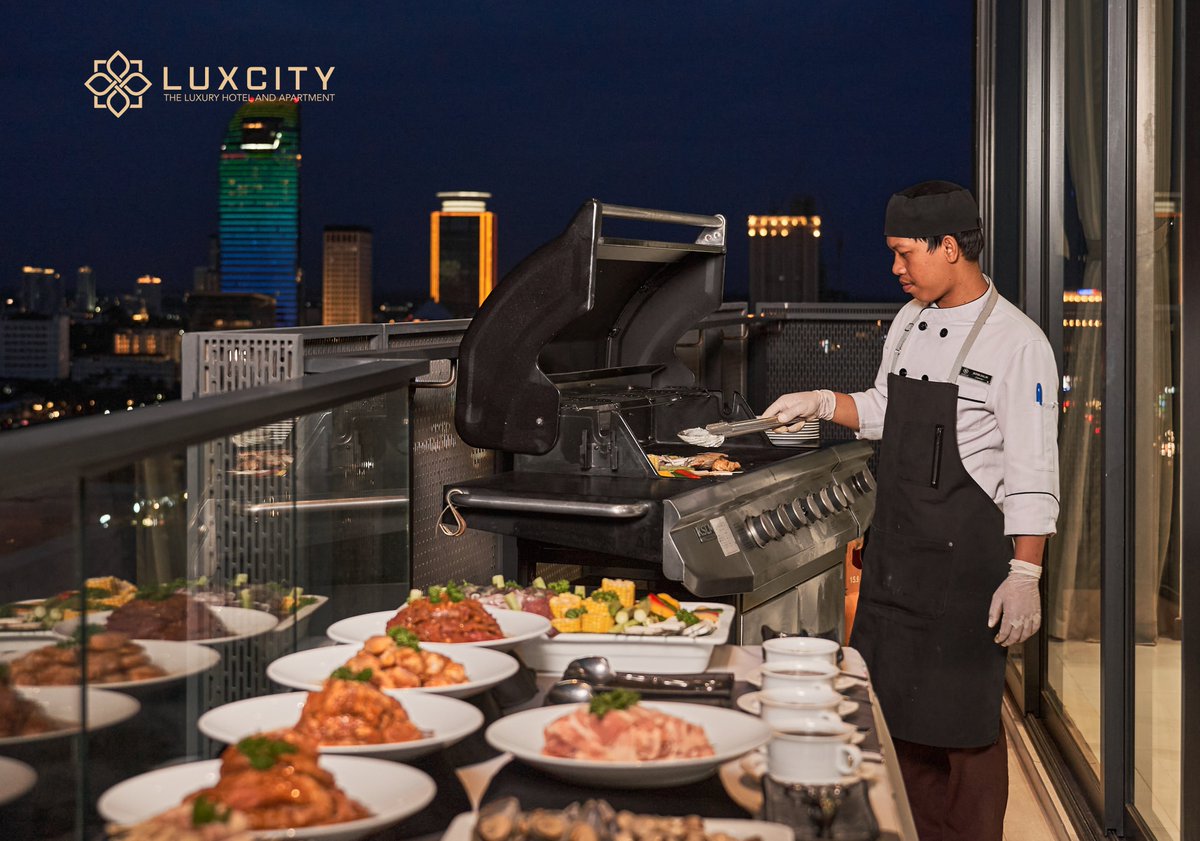 Imagine a warm evening, as the sun sets behind the horizon, casting a golden glow over the city. The air is filled with the savory aromas of sizzling meat and the sound of laughter and chatter. You're surrounded by the people you love, in the luxurious confines of Luxcity.