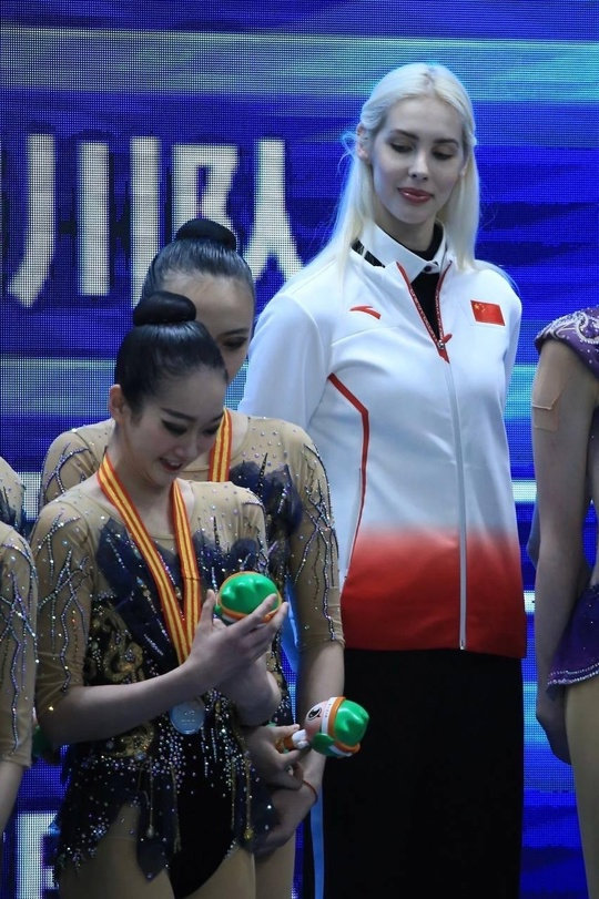 Two times Russian Olympic champion Anastasia Bliznyuk looks on as young Chinese women she coached go on to beat Israel to claim gold in the rhythmic gymnastics group gold.

Born in Zaporizhia, Ukraine in 1994 to former football player of Ukrainian national team Ilya Bliznyuk, she