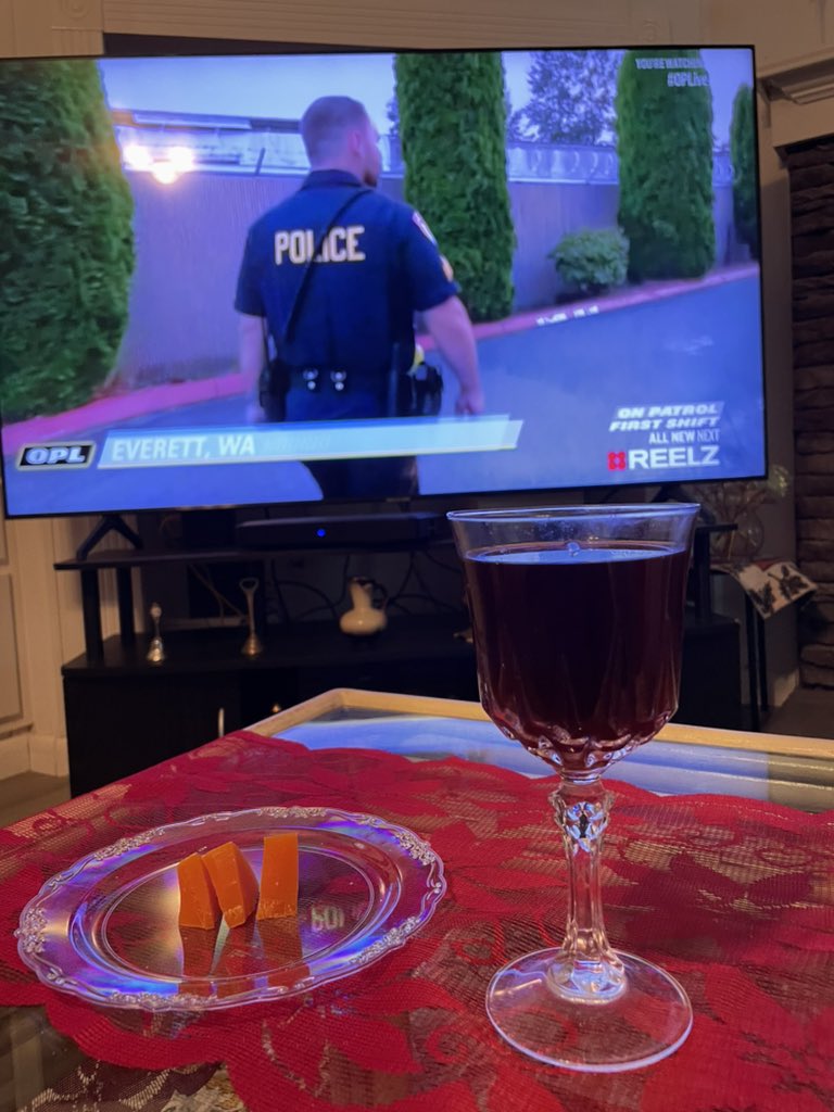 JLinchy's tweet photo. Kazuki and I are ready for tonight! Snack of the night for me some red wine and a special treat of Mimolette (yum)! #OnPatrolLive #OPNation #OPLive #Reelz #SnackoftheNight https://t.co/02yvHEJvoj