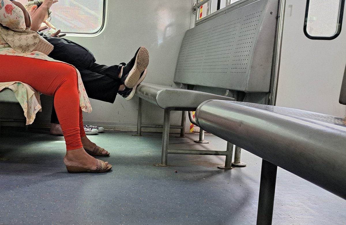 Ayre2025's tweet photo. Slow Virar AC Train No. 7022B... we have educated illiterate traveling in the ladies coach. She is sometimes sitting as shown in the photo.what to do??  @drmbct @WesternRly @AshwiniVaishnaw https://t.co/T02NeVExAz