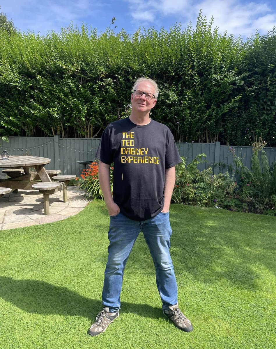thetdepodcast's tweet photo. Our lovely Paul is hosting the quiz at #zzaplive2024 this Saturday, Aug 17th. One of the prizes will be a TDE TEE (modelled here by the man himself). We’ve only made four of them (so far) so not a bad grab! #tdepodcast #TDE https://t.co/nqDdsYQ1vy