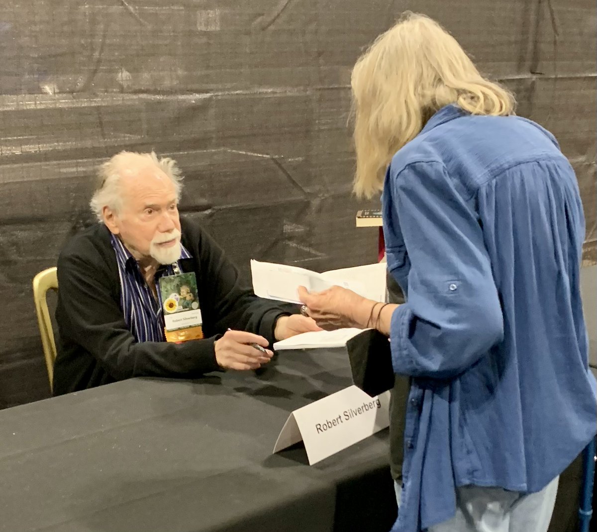 p_clift's tweet photo. Legendary sci-fi writer Robert Silverberg signs copies of his book at the World Sci-fi Convention in Glasgow.  He is a multiple winner of Hugo and Nebula awards. #sciencefiction https://t.co/jULfbrVuPw