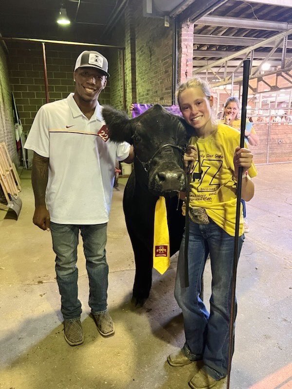 KeithMurphy's tweet photo. Iowa State Fair Governor’s Charity Steer Show and 12-year old Kate Totemeier had quite the experience with David Carr and Audi Crooks. Her mom, Kelli, explains better than I could. 

“My daughter Kate was lucky enough to show with David Carr as her celebrity. What an amazingly humble human. So grateful that he said yes! They were named people’s choice award winners and the steer brought $42,000, all proceeds to the Ronald McDonald Houses of Iowa. 

“David said showing a steer for that long was like wrestling in the 3rd period his arm was tired and everyone was yelling at him. 😂😂 David’s parents came to watch and they were amazing as well! 

“Kate is a triplet born at the U of Iowa so being able to give back made this very special. The steers name was ZZ, our family raised him, and our shirts said Every Cyclone’s Crazy bout a sharp dressed man! 

“Kate picked David because he is a great role model of a never give up attitude. 

“Kate even got to “fan girl” out when Audi showed up to show a steer for another family! The show in total raised $568,000 for the Ronald McDonald Houses of Iowa.”

Thank you Kelli and Eric Totemeier, Kate’s parents. 

👏🏻 ❤️ 🫡