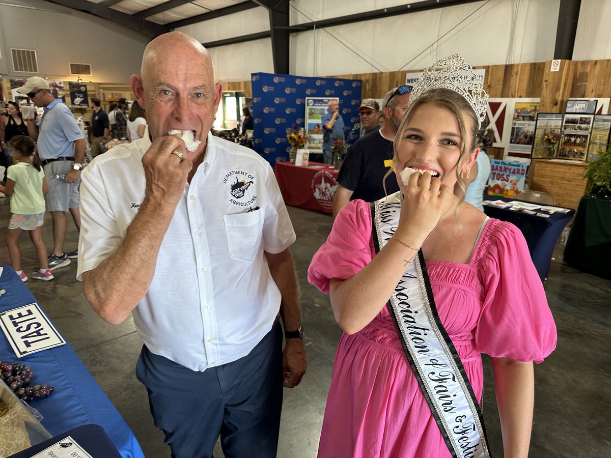 WVDeptofAg's tweet photo. What's the sweetest treat in the #WVCountryStore at the #SFWV? Maple cotton candy, of course! Commissioner Leonhardt and WV Assoc. of Fairs and Festivals Queen Alyssa Lilly enjoyed a taste. Stop by the Gus R. Douglass Annex to sample and buy! https://t.co/GwWTIyTiL2