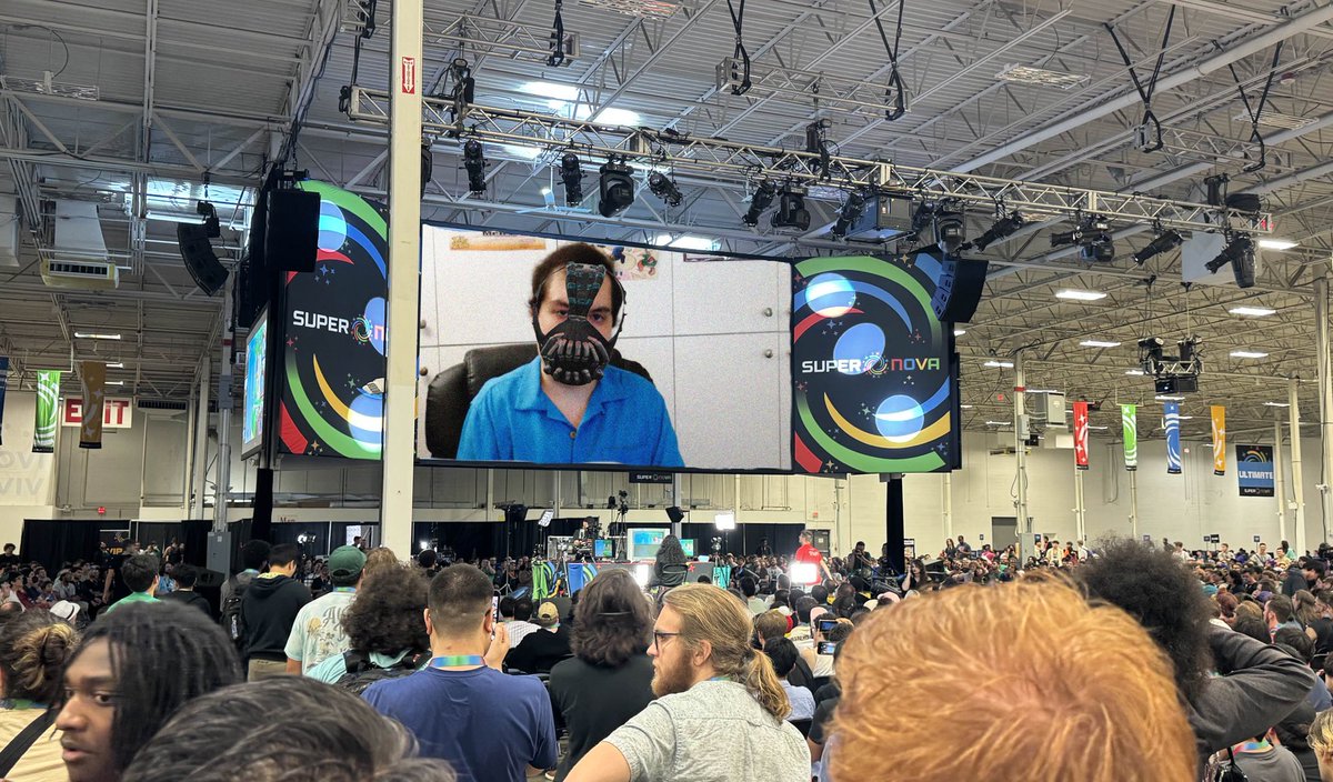 The big screen just went black in here and holy shit i think he hacked into the smash con computers. He keeps talking about reclaiming what is ours.