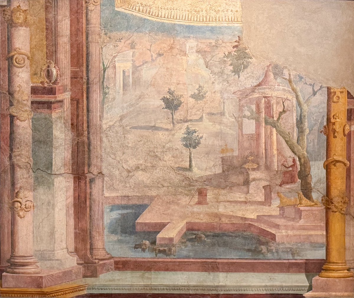 chapps's tweet photo. 4th style fresco of a sacred enclosure with a tholos temple, a statue of the goddess Isis holding a sistrum, golden sphinxes, and a tree-lined square, seen through a theatrical architectural proscenium.
Ekklesiasterion, Temple of Isis, #Pompeii (VIII 7, 28).
#MANNapoli 📸 me https://t.co/xReqyPVYFY