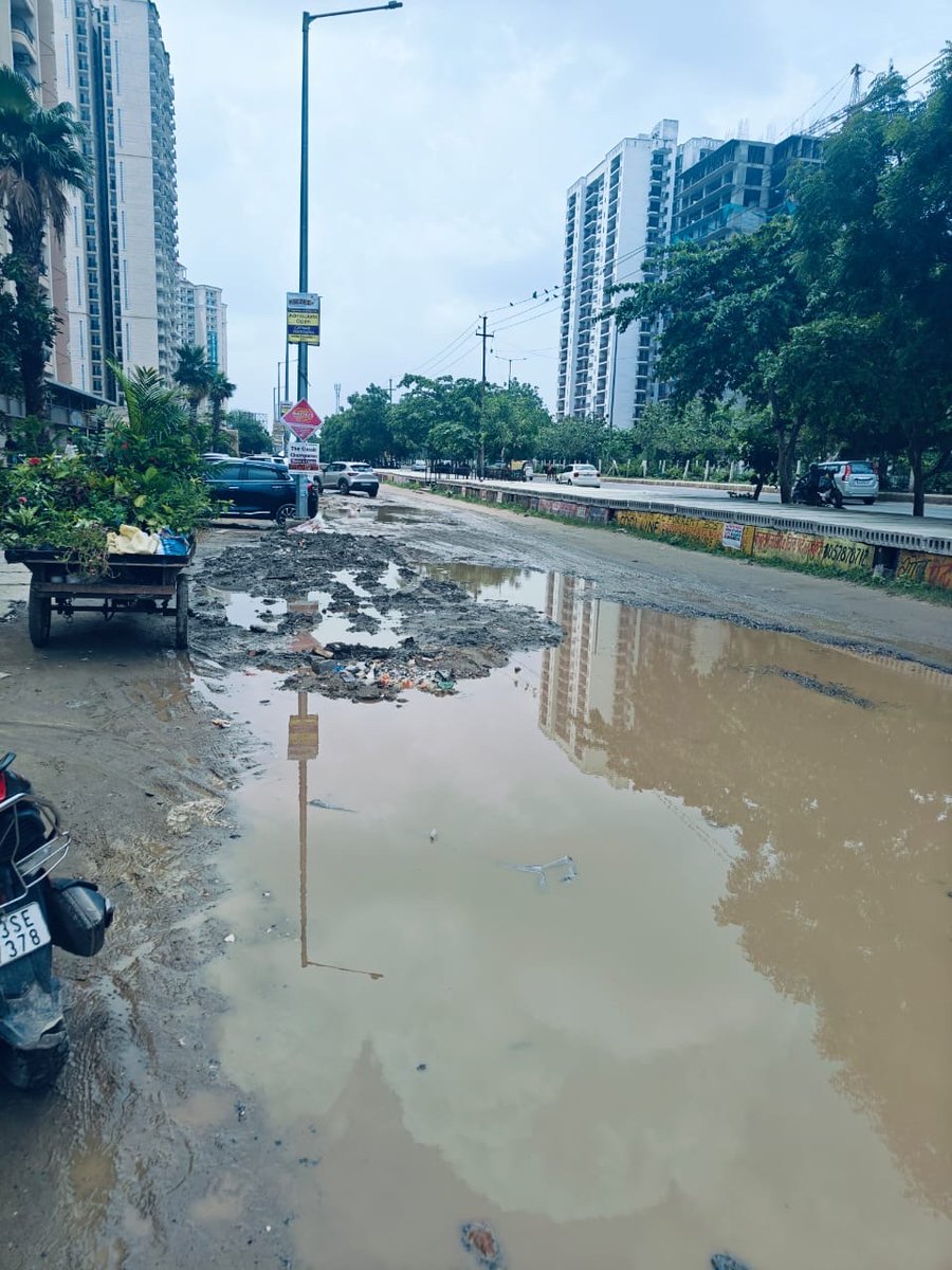 priyanka108m's tweet photo. Hi Team @OfficialGNIDA,
Is there any plan to fix main &amp; service roads in Gr Noida west sector 1 area? Attaching few images of the condition outside r society. This’s what we get after paying huge taxes? 
@nitin_gadkari @narendramodi  @aajtak @PMOIndia @dr_maheshsharma https://t.co/up3xZr0K5N
