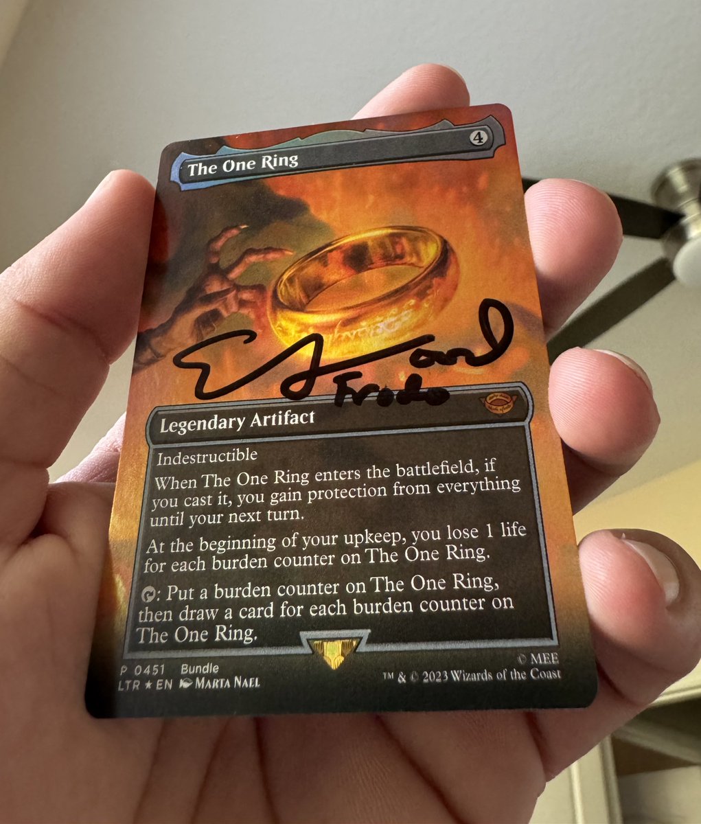 Elijah Wood signed my The One Ring card. 
I love The Lord of the Rings.
I love Magic the Gathering.
It is precious to me.