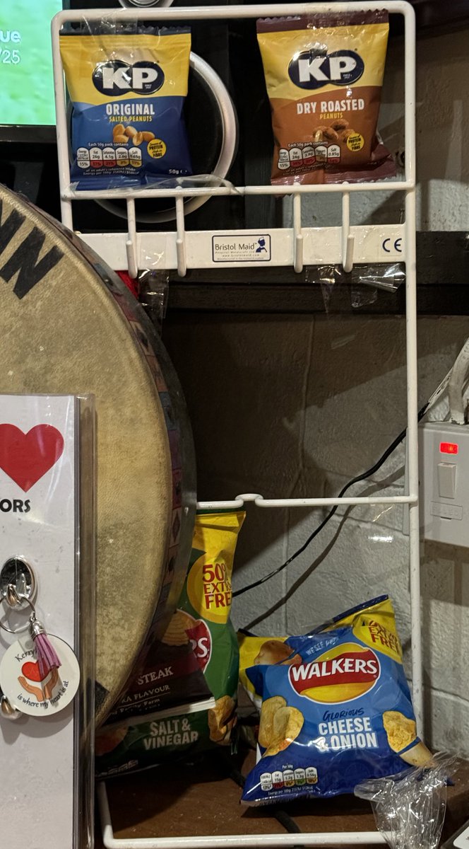 Kieranpmccormic's tweet photo. Who knew a @Bristol_Maid catheter stand could be so versatile? 🌟 Last night in a wee bar in Donegal, I spotted this stand behind the bar being used for displaying crisps & nuts 🤣 I laughed so hard and no one could understand what randomly made me laugh out loud! The plot thickens - The owner informed he found it in a skip when clearing out the bar last year 🤷‍♂️ 

@KPSnacks & @walkers_crisps new display ideas💡 

Ever looked at a piece of equipment and thought, "What else could I use this for?" 🤔 Share your creative uses of nursing equipment! 👇🎉 #CreativeThinking #Humor #LifeHacks #UnexpectedUses #Nursing #Nurses
