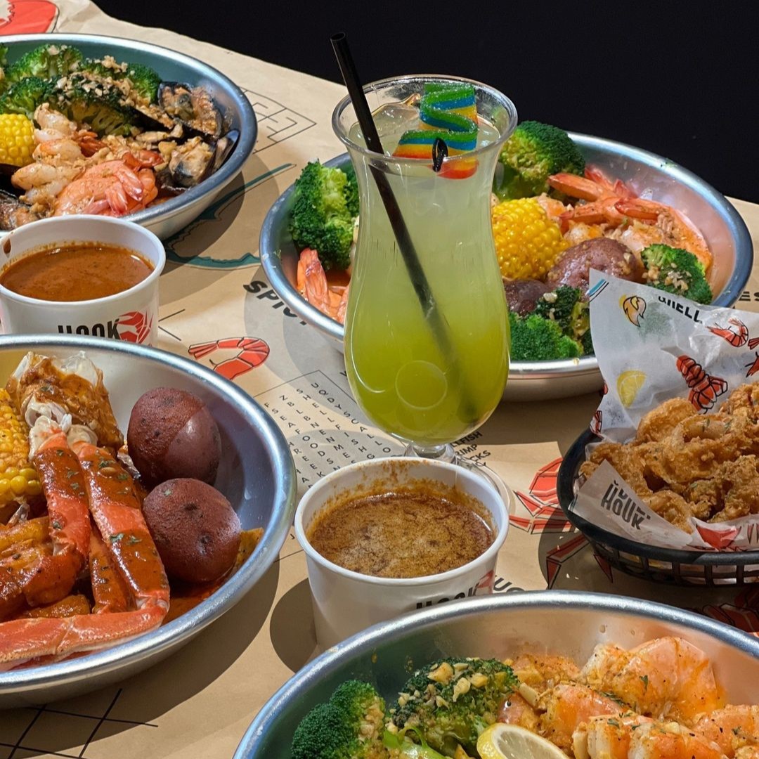 Don’t just dream of a table full of juicy shrimp, succulent crab legs, and tender lobster, paired with perfectly seasoned corn and potatoes. Taste it at Hook &amp; Reel! Dive into a feast that promises delicious flavors and satisfying portions at Hook &amp; Reel!