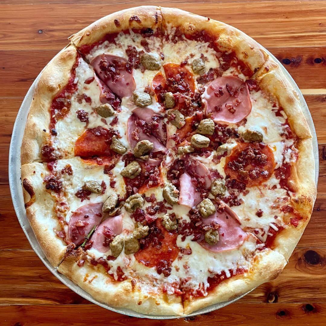 A guest favorite - The Grease Bucket!  Red sauce, shredded mozzarella cheese, pepperoni, Italian sausage, bacon &amp; Canadian bacon.  For the carnivore in you 🍖