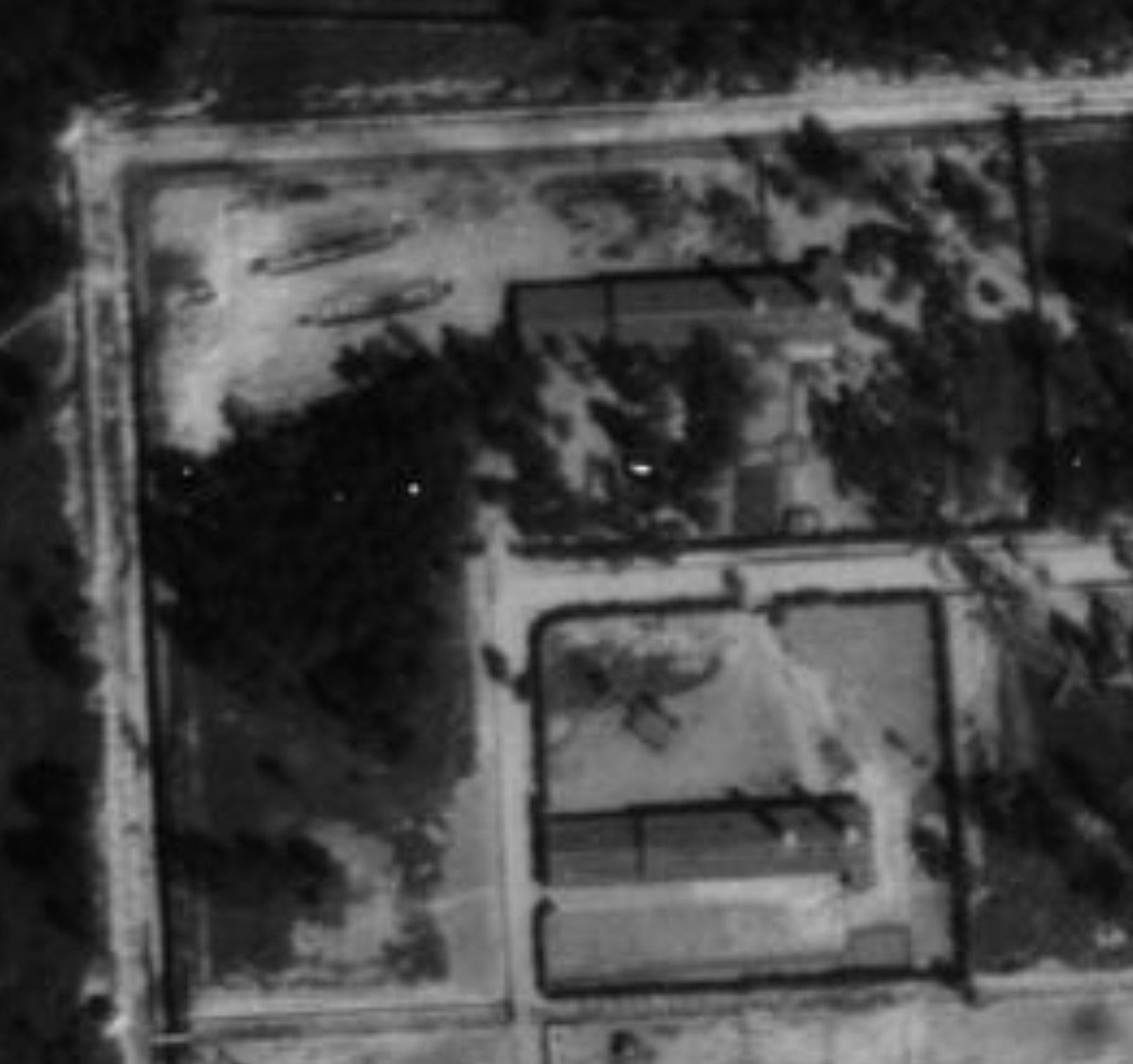 AuschwitzMuseum's tweet photo. 25 August 1944 | Auschwitz II-Birkenau 

Behind gas chamber and crematorium V, the marks of burning pits used for open-air cremation are visible. 

This was the place where prisoners of the Sonderkommando took the photographs of burning of corpses. Listen to our podcast about their tragic fate: https://t.co/FWGoYsZcEi