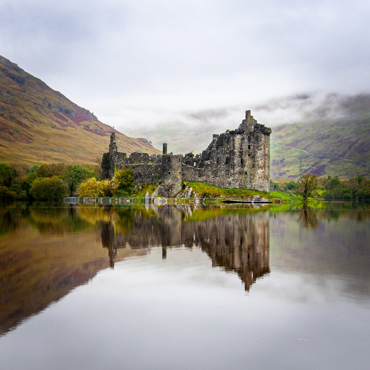 Kilchurn Castle on the banks of Loch Awe must be one of Scotland's  most photogenic .... and there is stiff competition. Low lying  cloud hugging the hillside after heavy rainfall seems to make it more  atmospheric #Scotland #landscapephotography #photography #scottishcastle