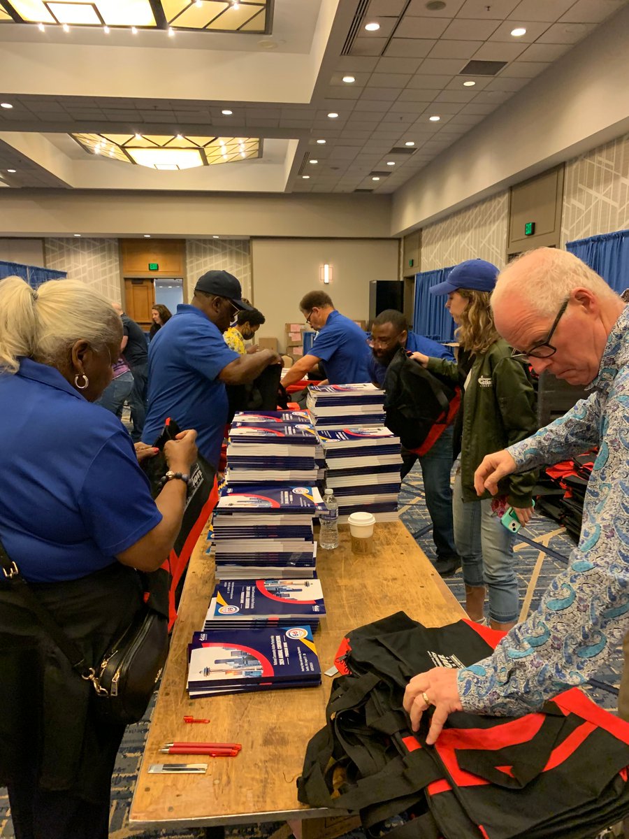 CAPartnership's tweet photo. NCAP staff and our awesome friends from Tight Ship are hard at work stuffing attendee tote bags and assembling signage in preparation for #CAPCON24, which gets underway this week in Seattle! Excited to commemorate 60 years of #CommunityAction! #60YearsStrong #CommunityAction60 https://t.co/1Bn9Alzj2E