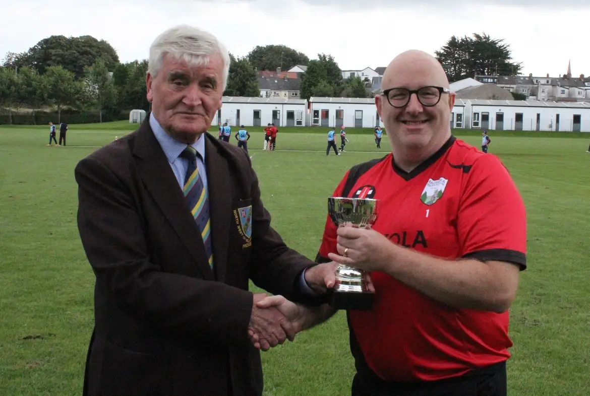 Captain Talbot being presented with the trophy.