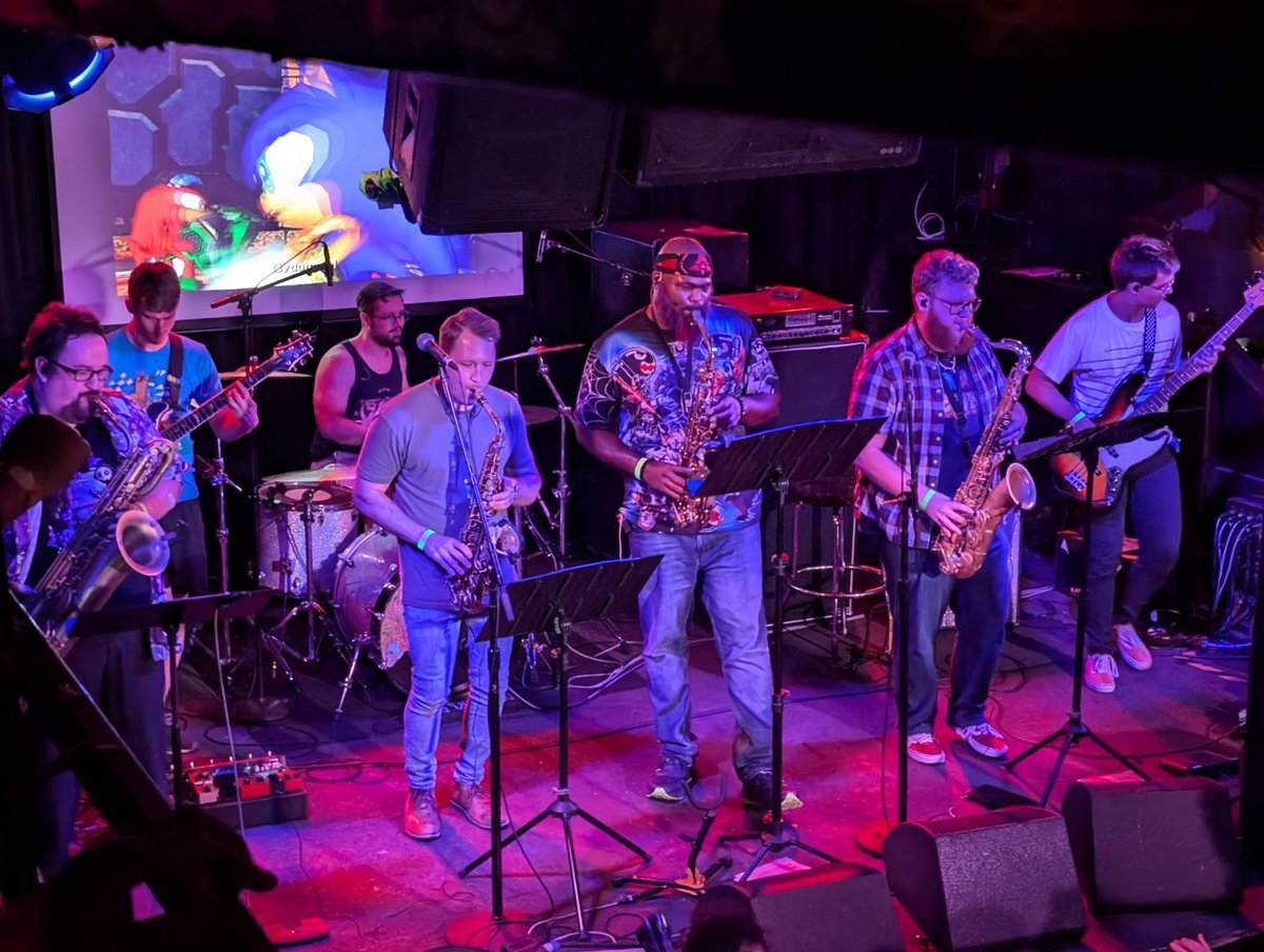 Missed our set at <a href="/BitGenGamerfest/">Bit Gen Gamer Fest</a>? Well, we’ve got you covered with a Balcony Bootleg ™, featuring a special guest appearance by Dave Pollack! -🎷youtu.be/PNWv2V30nXc